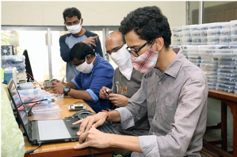 Sandesh and Mahesh preparing bootable USB drives
