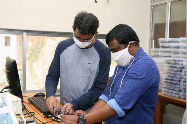 Sadanand and Maheshwar performing final hardware checks
