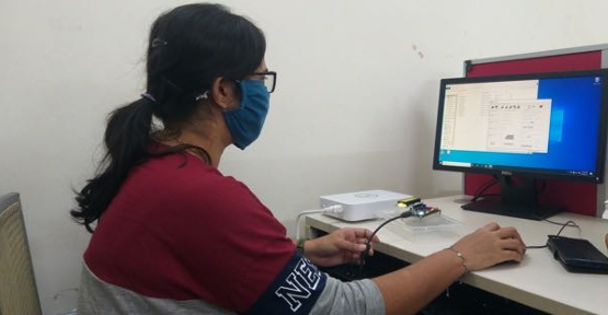 IIT Dharwad teaching assistants working on a microcontroller lab kit