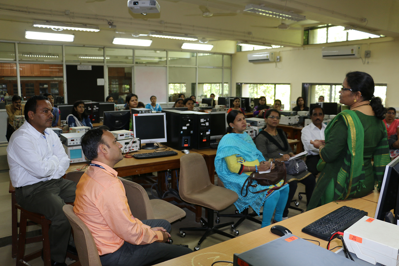 WEL staff speaking to a visiting college team